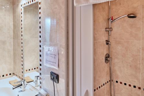 a bathroom with a shower and a sink at Residence SoleNeveSila B&B in Camigliatello Silano
