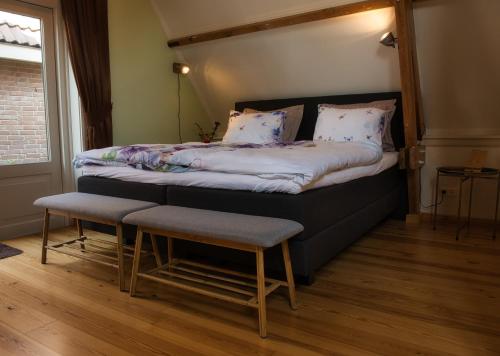 a bedroom with a bed with a canopy at Com-In in Alkmaar