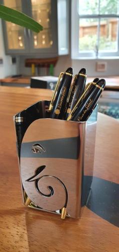 a container filled with utensils on top of a table at Fleur du Soleil Luxury Guesthouse in Franschhoek