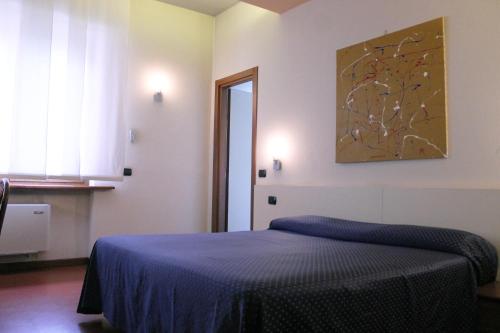 Postel nebo postele na pokoji v ubytování HOTEL OASI