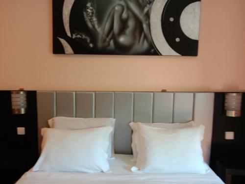 a bed with a picture of a man on it at Faria Guimares Porto Centro - Rooms & Cosy Apartments in Porto