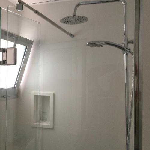 a shower with a glass door in a bathroom at SUNNY DAY Deluxe 14 in La Playa de Arguineguín