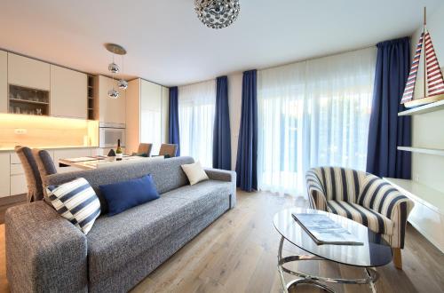 a living room with a couch and a table at Villa Lungomare in Malinska