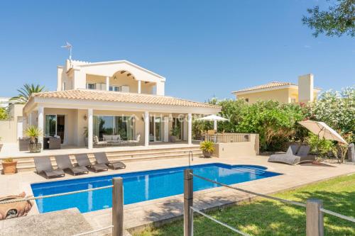 an image of a villa with a swimming pool at Villa Mala Bay in Mahón
