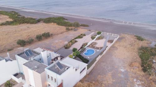 an aerial view of a house on the beach at Aegiali Sea View Villa in Gennadi