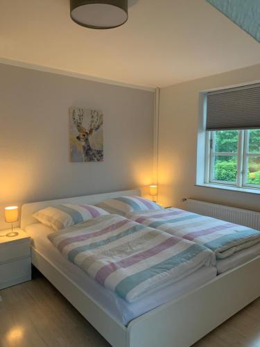 Säng eller sängar i ett rum på Ferienhaus SüdWest