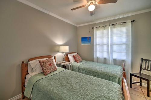 a bedroom with two beds and a ceiling fan at Cozy San Antonio Family Home 3 Mi to Lackland AFB in San Antonio