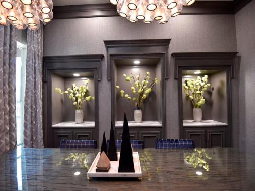 a lobby with a table with flowers on it at Lavish Apartment near Houston Medical Centre in Houston