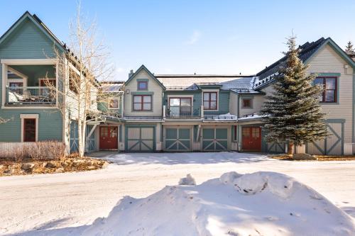 a large house with snow in front of it at Main Street Junction in Breckenridge