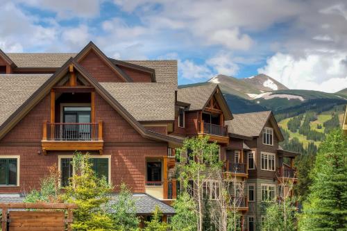 a house with a mountain in the background at Water House on Main Street in Breckenridge