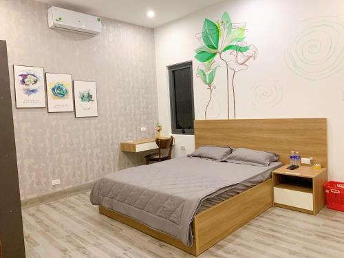 Ένα ή περισσότερα κρεβάτια σε δωμάτιο στο HOMETEL TÂM ĐAN