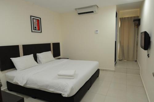 Llit o llits en una habitació de ND Hotel Melaka