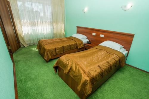 
Кровать или кровати в номере Hotel Centralnaya

