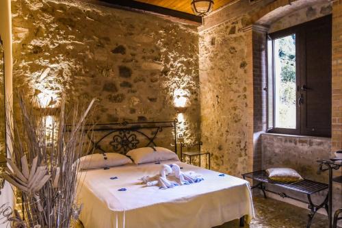 Кровать или кровати в номере Agriturismo L'impero Romano