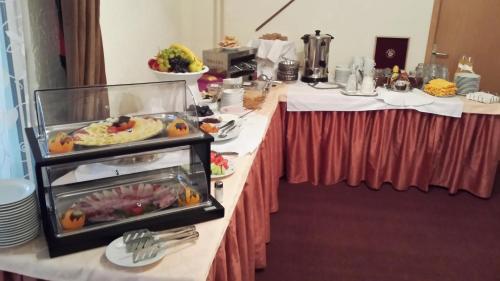 two buffet tables with food on them at Guesthouse Stari Tišler in Ljubljana
