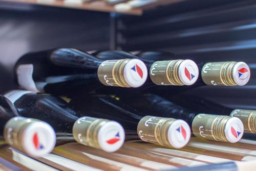 a row of bottles of wine on a shelf at Horský hotel Vidly in Karlova Studánka