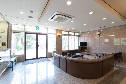 a waiting room with a bar in a hospital at Tabist Nisseiya Beppu Kannawa in Beppu