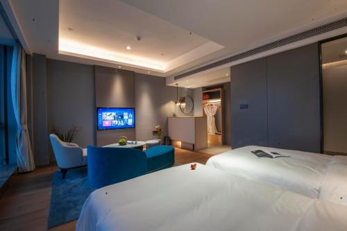 Postel nebo postele na pokoji v ubytování SSAW Boutique Hotel Wenzhou Dexin