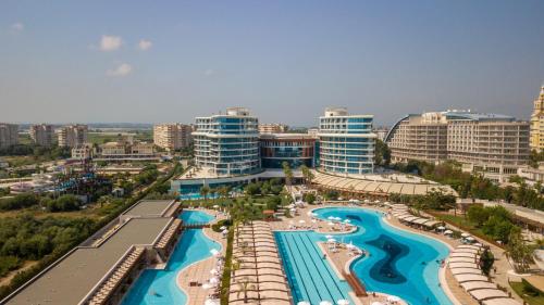 an aerial view of a resort with a pool at Baia Lara Hotel in Lara