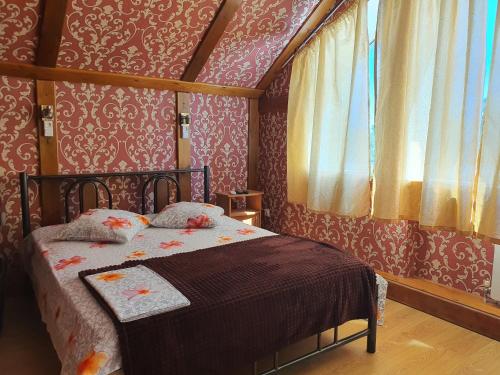 Giường trong phòng chung tại Hotel Economy Classa Edelweiss