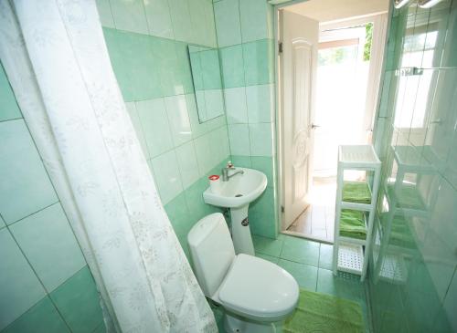 Phòng tắm tại Центральный гостевой дом