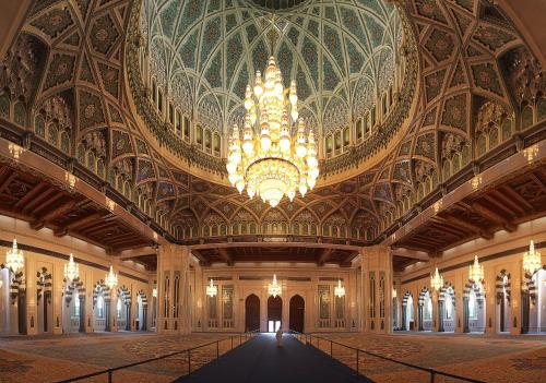 a large room with a large chandelier in a building at Holiday Inn Muscat AlSeeb by IHG in Muscat