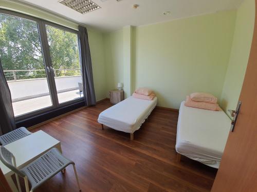 Postel nebo postele na pokoji v ubytování Sea Hostel