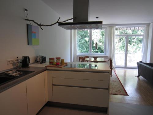 a kitchen with a sink and a counter top at K9 Wohnungen in Münster