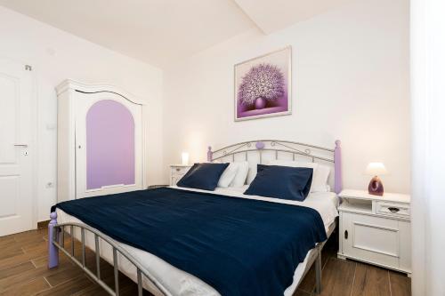 Łóżko lub łóżka w pokoju w obiekcie Casa Maria 2