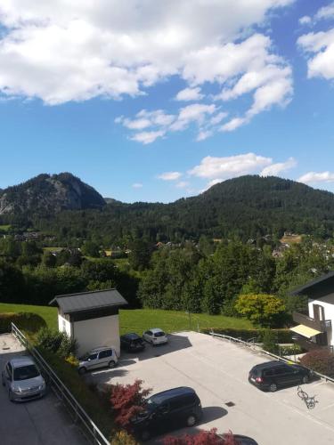 a view of a parking lot with mountains in the background at Ferienwohnung Evi in Sankt Gilgen