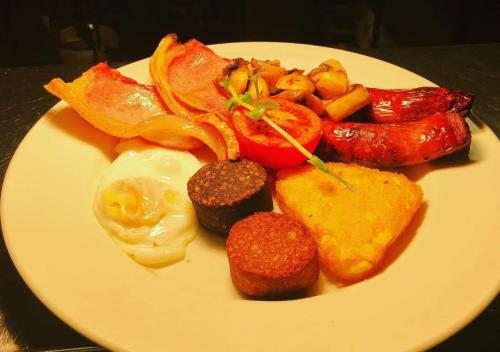 a white plate topped with different types of food at Kiltimagh Park Hotel in Kiltimagh