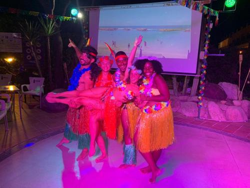a group of women dancing on a stage with lights at Hotel Alba Seleqtta in Lloret de Mar