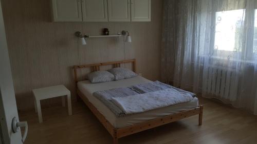 Postel nebo postele na pokoji v ubytování Apartament Gryfitów