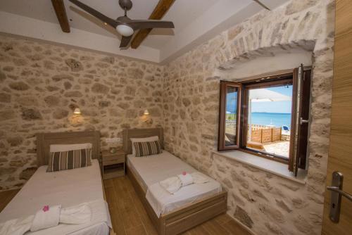 Postel nebo postele na pokoji v ubytování Abraham Apartments