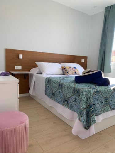 a bedroom with a large bed with at Sereíña Beach in Vigo