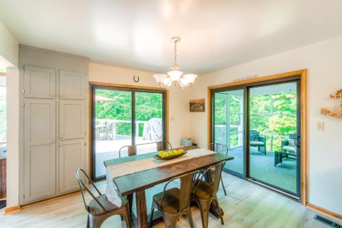 a dining room with a wooden table and chairs at LKA Getaway in Bumpass