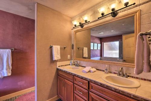 a bathroom with two sinks and a large mirror at Prescott Home Less Than 5 Miles to Butte Creek Trail! in Prescott
