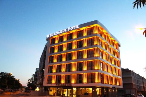 a building with a hotel sign on top of it at YURDAKUL HOTEL in Barbaros