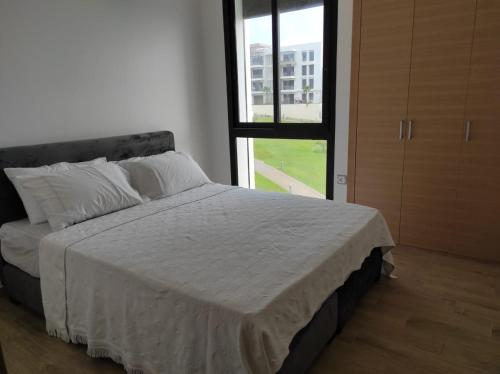 Postel nebo postele na pokoji v ubytování Bel appartement à plage des Nation