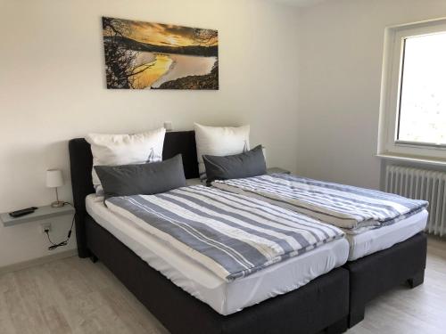 Postel nebo postele na pokoji v ubytování Ferienwohnung Zum Wildpark