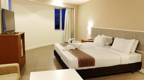 Postel nebo postele na pokoji v ubytování Trang Hotel Bangkok - SHA Plus