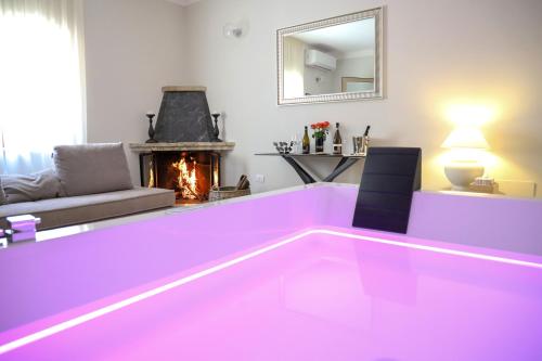 a living room with a hot pink dance floor at Agriturismo Cantina Morone in Guardia Sanframondi