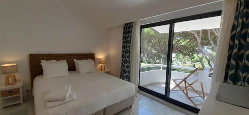 Postelja oz. postelje v sobi nastanitve Quinta do Lago Beach House