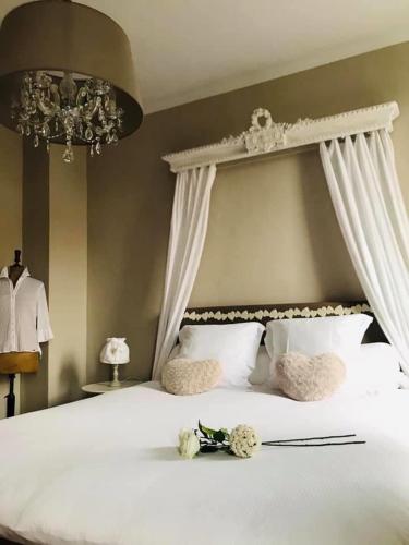 Ein Bett oder Betten in einem Zimmer der Unterkunft B&B Le Cloître St Joseph