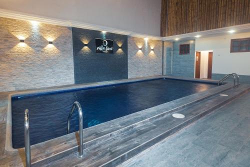 a large swimming pool in a room at Galapagos Native in Puerto Ayora