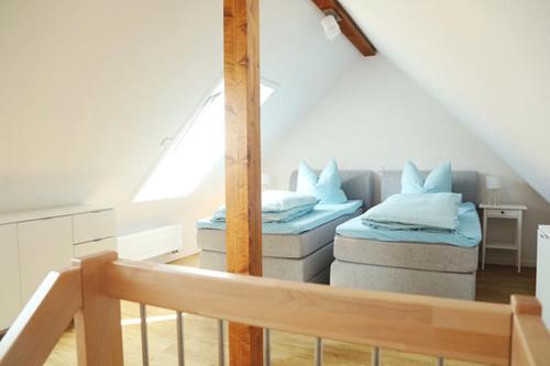 מיטה או מיטות בחדר ב-Rüdlins-Winzerhof