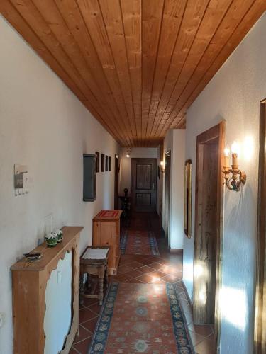 a hallway of a house with a wooden ceiling at Exklusiv Apartment Sonnenalp in Niederau