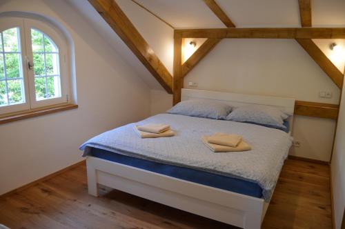 Postel nebo postele na pokoji v ubytování Garden House Splavský zámeček