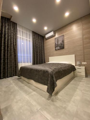 Кровать или кровати в номере Soul City Apart Hotel