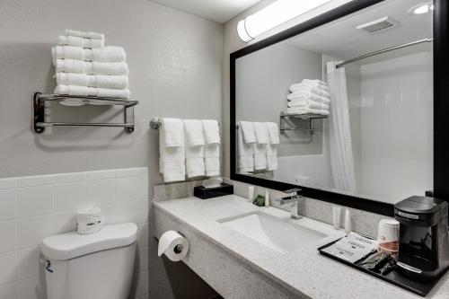 A bathroom at Days Inn & Suites by Wyndham Spokane